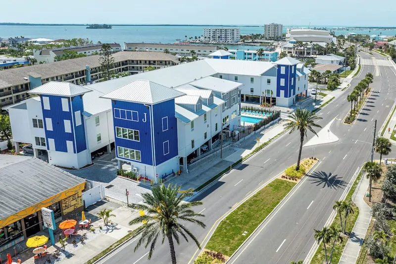 Aerial view of The J Hotel on Causeway Boulevard with the gulf behind it