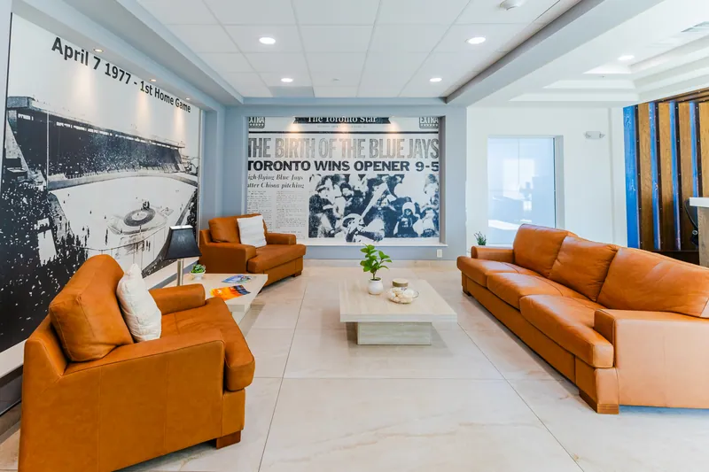 Lobby lounge with leather sofas and a wall of Blue Jays history